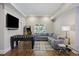 Comfortable game room with a foosball table, TV, an L-shaped couch, and a neutral color scheme at 4205 Cobble Trot Way, Johns Island, SC 29455