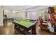 Spacious game room with a pool table, foosball, ping pong, and arcade games, perfect for entertaining at 4205 Cobble Trot Way, Johns Island, SC 29455