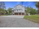 Spacious three-car garage of a modern home with additional parking and access to backyard amenities at 4205 Cobble Trot Way, Johns Island, SC 29455