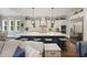 Open kitchen featuring a large island with seating, modern appliances, and hardwood floors at 4205 Cobble Trot Way, Johns Island, SC 29455