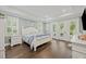 Light and airy main bedroom featuring hardwood floors, French doors and recessed lighting at 4205 Cobble Trot Way, Johns Island, SC 29455