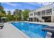Backyard pool with connected covered seating area and upper level deck at 4205 Cobble Trot Way, Johns Island, SC 29455