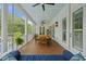 Wide covered porch with ceiling fan and spacious seating area at 4205 Cobble Trot Way, Johns Island, SC 29455