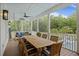 Large covered porch with dining table and ceiling fan at 4205 Cobble Trot Way, Johns Island, SC 29455