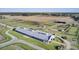 Beautiful horse farm featuring paddocks, riding rings, stable, and surrounding landscape at 4233 Lady Banks Ln, Ravenel, SC 29470