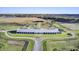 Expansive horse farm with riding arenas, paddocks, and a modern stable, perfect for equestrian pursuits at 4233 Lady Banks Ln, Ravenel, SC 29470