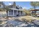 Backyard with a screened in porch, grill, and kayak storage rack at 4233 Lady Banks Ln, Ravenel, SC 29470