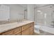 Granite countertops, wood cabinets, and a glass shower door highlight this bathroom at 4233 Lady Banks Ln, Ravenel, SC 29470