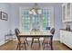 This dining area has a large window and chandelier lighting at 4233 Lady Banks Ln, Ravenel, SC 29470