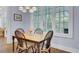 This dining area has a chandelier and a large window at 4233 Lady Banks Ln, Ravenel, SC 29470