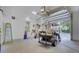 This garage features a golf cart, work bench and cabinets for lots of storage at 4233 Lady Banks Ln, Ravenel, SC 29470