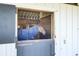 Horse stable interior featuring classic wood with a blue-blanketed horse inside at 4233 Lady Banks Ln, Ravenel, SC 29470