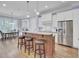 Modern kitchen with granite island, stainless steel appliances, and eat-in area at 4233 Lady Banks Ln, Ravenel, SC 29470