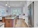 Kitchen features granite countertops, stainless steel appliances, and hardwood floors at 4233 Lady Banks Ln, Ravenel, SC 29470