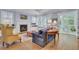 Bright living space with fireplace, built-in shelving, and a view to the outdoors at 4233 Lady Banks Ln, Ravenel, SC 29470