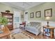 Bright and airy sitting room with hardwood floors, comfortable seating, and a classic bookcase at 4233 Lady Banks Ln, Ravenel, SC 29470