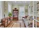 Cozy sitting room with hardwood floors, a bookcase, comfortable seating, and natural light at 4233 Lady Banks Ln, Ravenel, SC 29470
