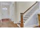 Beautiful staircase with wood railings and white banisters at 4233 Lady Banks Ln, Ravenel, SC 29470