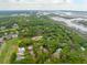 The community featuring lush greenery, a golf course, and picturesque waterfront views at 4291 Turtle Landing Ct, Johns Island, SC 29455