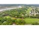 An aerial view of homes lining a golf course with pond and scenic waterfront views at 4291 Turtle Landing Ct, Johns Island, SC 29455