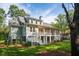 Spacious backyard with a covered porch, a well-maintained lawn, and mature trees for added privacy at 4291 Turtle Landing Ct, Johns Island, SC 29455