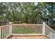 Picturesque backyard view from the deck, showcasing lush greenery and mature trees at 4291 Turtle Landing Ct, Johns Island, SC 29455