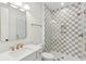 Modern bathroom features checker-board tile, sleek fixtures, and glass shower at 4291 Turtle Landing Ct, Johns Island, SC 29455