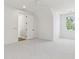 Bright bedroom boasts a ceiling fan, ensuite bathroom and plush carpet at 4291 Turtle Landing Ct, Johns Island, SC 29455