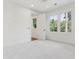 This bedroom has 2 windows, ceiling fan, ensuite bathroom and plush carpet at 4291 Turtle Landing Ct, Johns Island, SC 29455