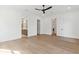Bright bedroom with wood flooring, white trim, and access to the en-suite bathroom and walk-in closet at 4291 Turtle Landing Ct, Johns Island, SC 29455