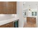 Butler's pantry featuring built in cabinets with wine fridge, countertops, and white subway tile backsplash at 4291 Turtle Landing Ct, Johns Island, SC 29455