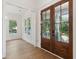 Elegant entryway featuring a front door and white wainscoting to the left at 4291 Turtle Landing Ct, Johns Island, SC 29455