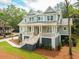 Charming two-story home boasts a welcoming front porch and professionally landscaped yard at 4291 Turtle Landing Ct, Johns Island, SC 29455