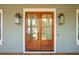 Inviting double front doors with sidelights and modern lighting fixtures enhance the home's curb appeal at 4291 Turtle Landing Ct, Johns Island, SC 29455