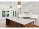 Spacious kitchen features white cabinets, stainless steel appliances, and a large island with a quartz countertop at 4291 Turtle Landing Ct, Johns Island, SC 29455