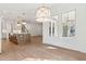 Bright open kitchen featuring wood floors, a center island, modern lighting, and large windows overlooking the yard at 4291 Turtle Landing Ct, Johns Island, SC 29455