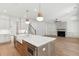 Spacious kitchen features a large island, stainless steel appliances, and flows into the adjoining spaces at 4291 Turtle Landing Ct, Johns Island, SC 29455