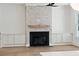 Living room showcases a fireplace with brick surround and built-in cabinets on either side at 4291 Turtle Landing Ct, Johns Island, SC 29455