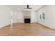 Spacious living room with a fireplace, built-in cabinets, ceiling fan and hardwood floors at 4291 Turtle Landing Ct, Johns Island, SC 29455