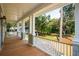 Expansive front porch offers stunning views of the meticulously landscaped yard at 4291 Turtle Landing Ct, Johns Island, SC 29455