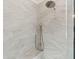 Modern shower with rain head and handheld sprayer, featuring marble-look tile surround at 4291 Turtle Landing Ct, Johns Island, SC 29455
