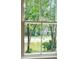 Scenic view of a pond and golf cart driving on the course, as seen through a window at 4291 Turtle Landing Ct, Johns Island, SC 29455
