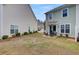 Townhome backyard with patio, furniture set, and landscaping at 4966 Hay Bale Ct, Summerville, SC 29485