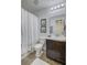 Well-lit bathroom with vanity, mirror, shower and modern fixtures at 4966 Hay Bale Ct, Summerville, SC 29485