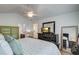 Cozy bedroom with a plush bed, a vaulted ceiling, and natural light, creating a relaxing and serene atmosphere at 4966 Hay Bale Ct, Summerville, SC 29485
