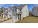 Townhome exterior showcasing its garage, landscaping, and neutral color palette at 4966 Hay Bale Ct, Summerville, SC 29485