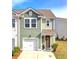 Charming two-story home with a one-car garage and a welcoming front porch with a decorative wreath at 4966 Hay Bale Ct, Summerville, SC 29485