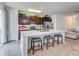Modern kitchen with a center island, barstool seating, dark cabinets, stainless steel appliances, and recessed lighting at 4966 Hay Bale Ct, Summerville, SC 29485