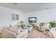 Cozy living room featuring stylish furniture, decorative plants, and ample space for relaxation and entertainment at 4966 Hay Bale Ct, Summerville, SC 29485