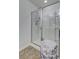 Bathroom featuring a glass enclosed shower with tile flooring and stylish storage at 4966 Hay Bale Ct, Summerville, SC 29485